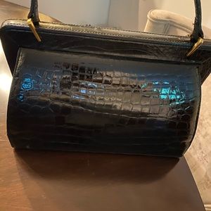 This is a Vintage Gucci genuine alligator handbag